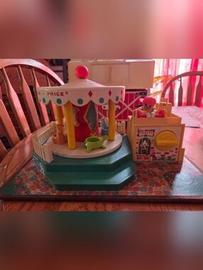 Vintage Fisher-Price Teal, Yellow, Red Musical Carousel Toy